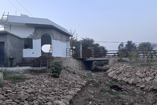Palms & Pebbles — building exterior with rocky terrain