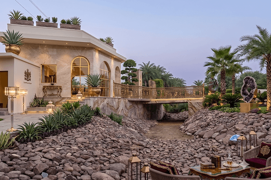 Palms & Pebbles — building exterior with rocky terrain
