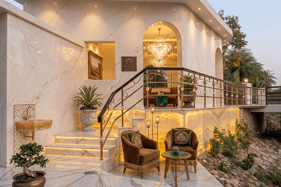 Palms & Pebbles — entrance stairs and arched doorway