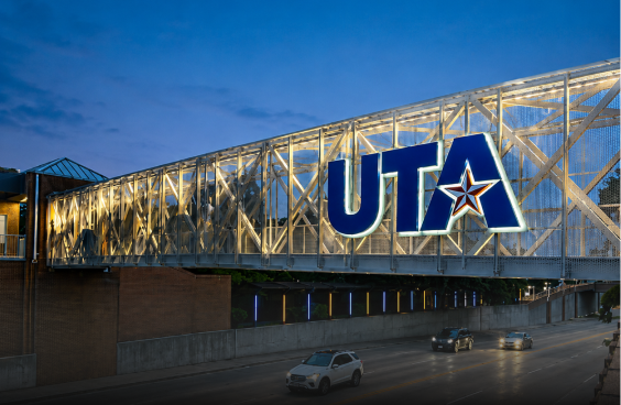 UTA pedestrian bridge over roadway at dusk