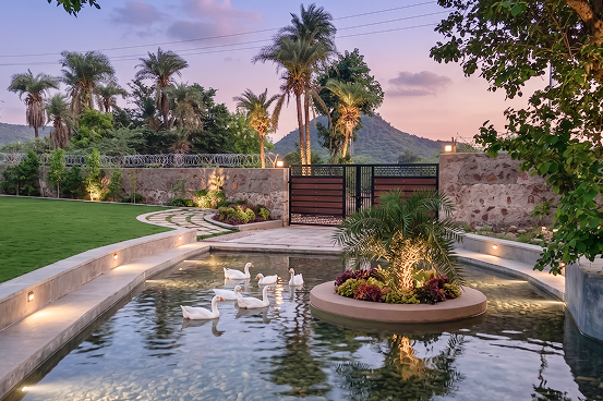 Palms & Pebbles — poolside lounge with underwater lighting