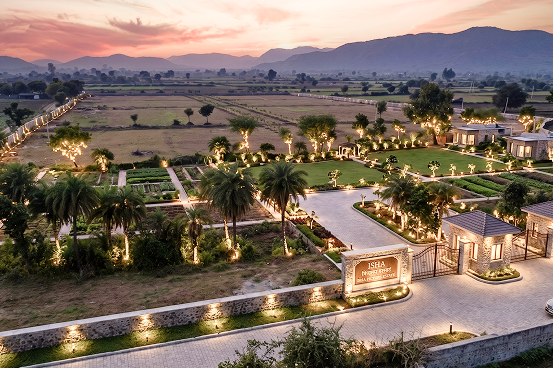 Palms & Pebbles — dusk pathways, lawns, and mountain skyline